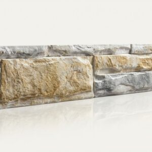 Mueble de piedra rectangular con textura rugosa, colores grises y beige.