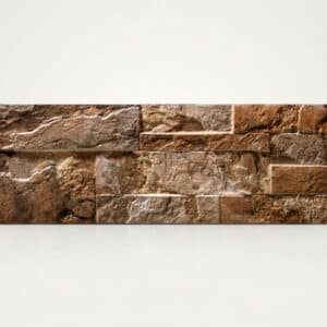 Mueble de piedra marrón con textura rugosa y forma rectangular, con varios tonos de marrón y beige.
