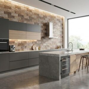 La imagen muestra una cocina moderna con suelos de cemento pulido de color gris claro. La cocina cuenta con encimeras de piedra, armarios de cocina de color gris oscuro y una isla central con taburetes. La pared está revestida con ladrillos de piedra de colores marrón y beige. La iluminación es clara y natural, gracias a una gran ventana que deja pasar la luz exterior.